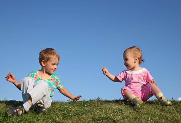 children-on-grass-with-flowers.jpg